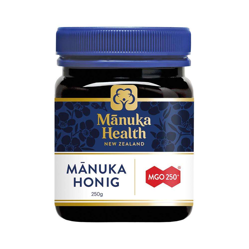 Ein Glas Manuka-Honig mit blauem Deckel und Etikett aus Neuseeland.